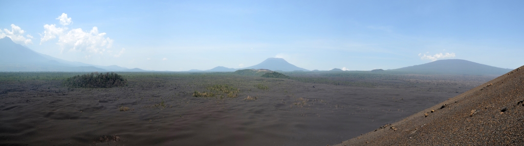 Panoramic view from the 2011-2012 eruptive site of Nyamulagira. From left to right: Mikeno, Nyiragongo and Nyamulagira volcanoes. Photo (c) B. Smets, 2012.