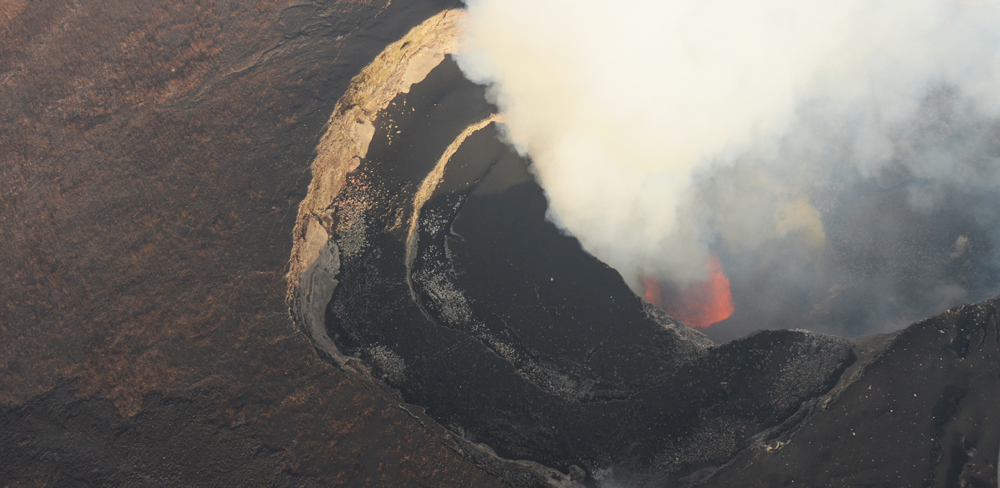 Fire fountains observed in the pit crater located in the NE part of the Nyamulagira caldera, on 1st July 2014. Photo (c) B. Smets